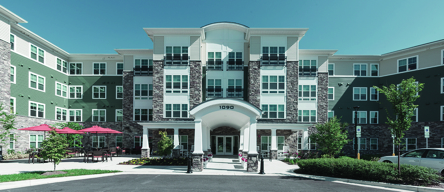 Exterior view of Victory Crossing apartment community after dedication ceremony