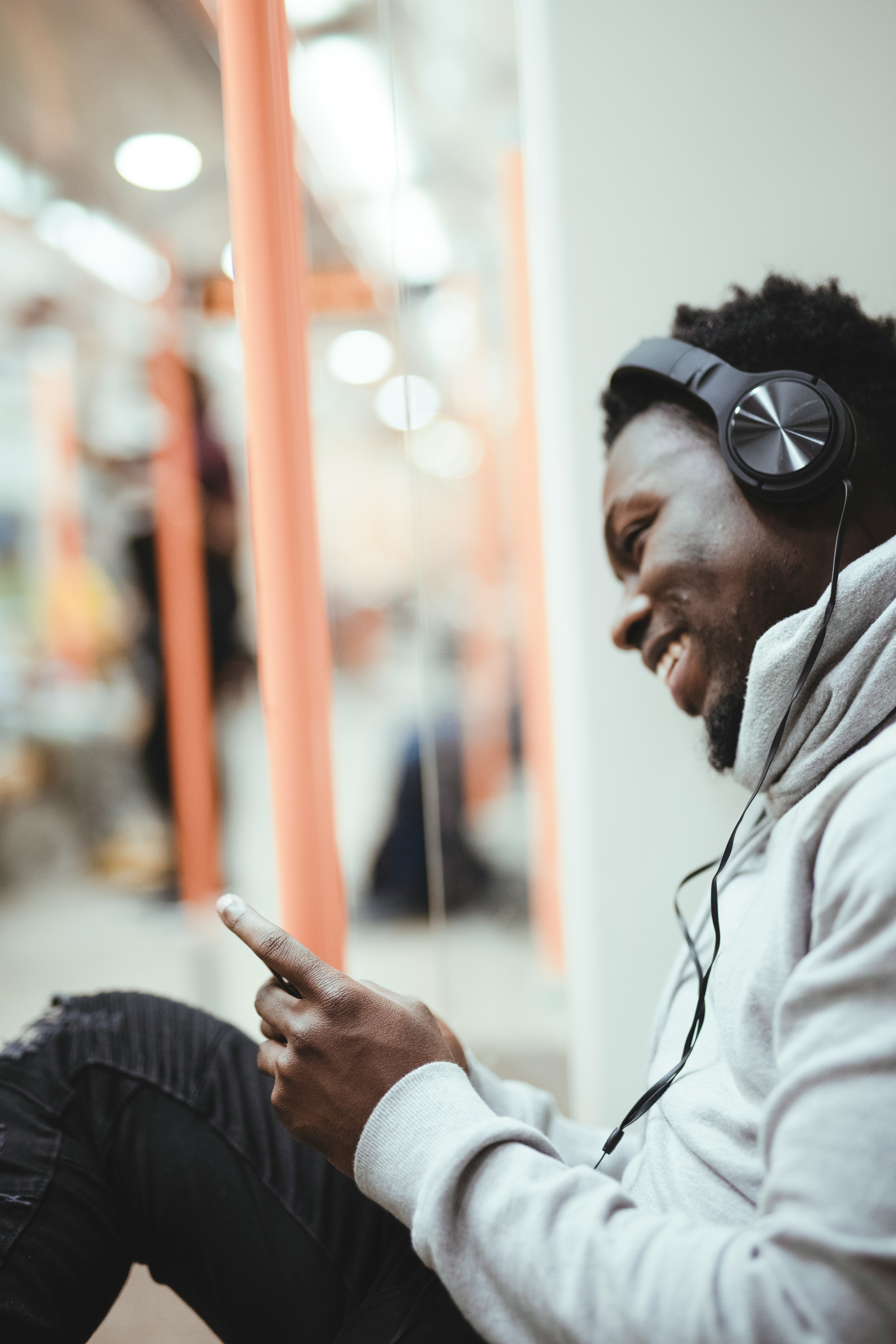 a resident listening to headphones at The Valerie